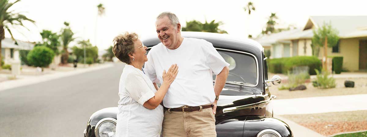 Couple in front of car